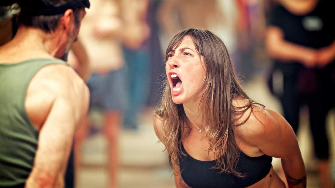 a woman releasing anger during a voice therapy session
